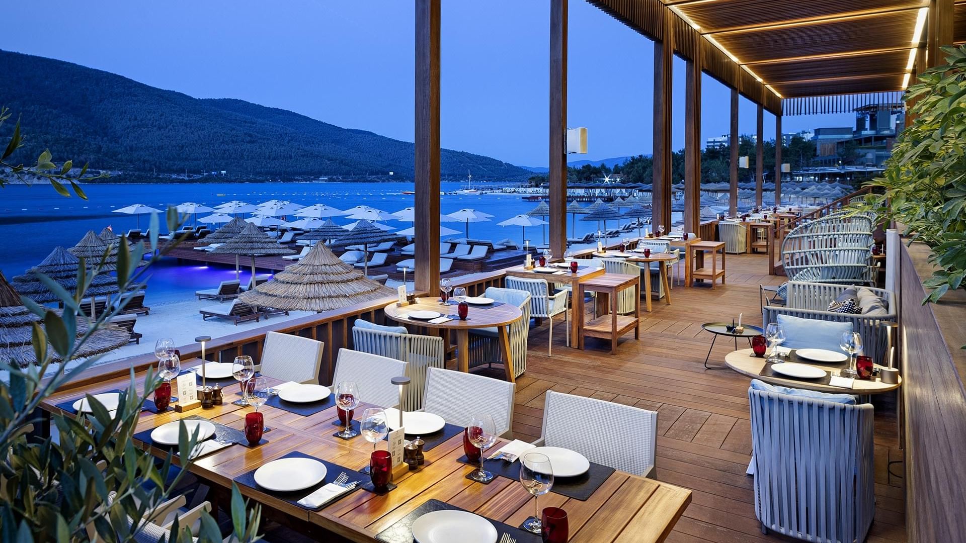 Dining tables set-up with sea View in an evening at Beef Grill Club, Cullinan Belek in Titanic Luxury Collection Bodrum