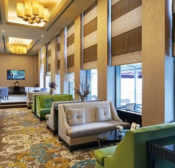 Cozy loungers around with dining tables in Titanic Coffee at Titanic Business Kartal