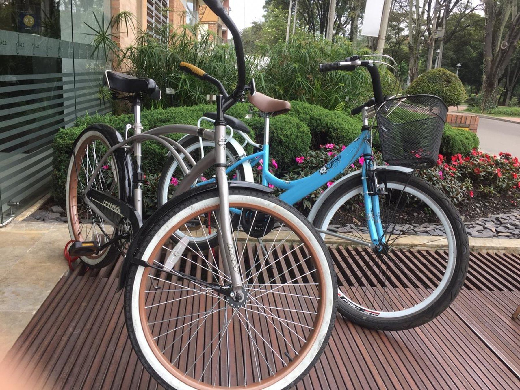 Two Rental bikes parked near Blue Doors Hotels