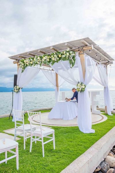 Lady preparing a table in wedding altar at Buenaventura Grand