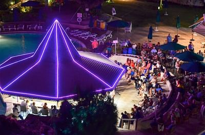 Distant view of people gathered by the pavilion for an event at Accra Beach Hotel & Spa