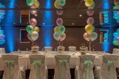 Well-arranged table for a baby shower at Orsett Hall Hotel