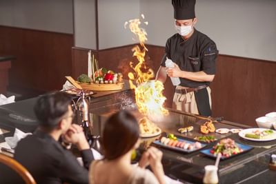 Chief making food live in restaurant at Hanoi Daewoo Hotel