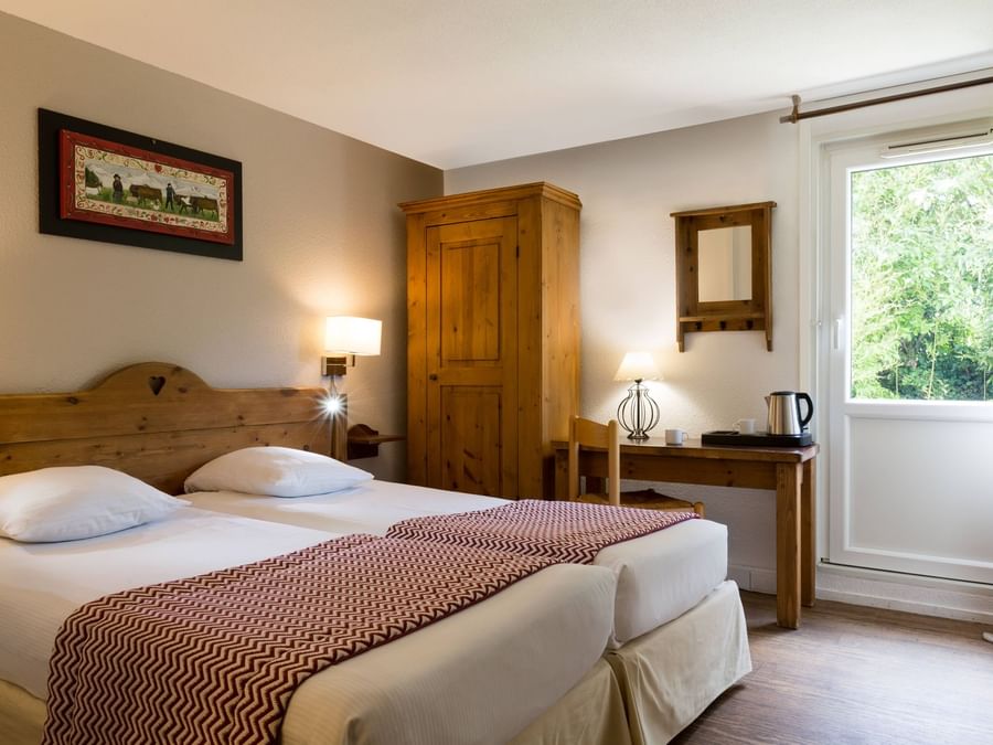 Bed & furniture in Hotel Porte de Geneve