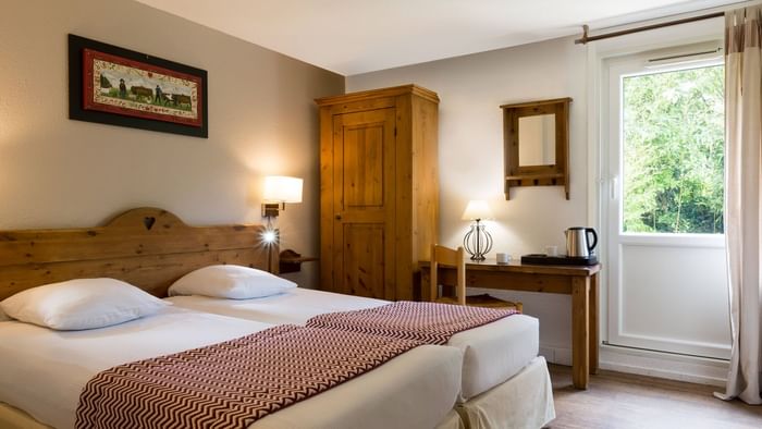 Bed & furniture in Hotel Porte de Geneve