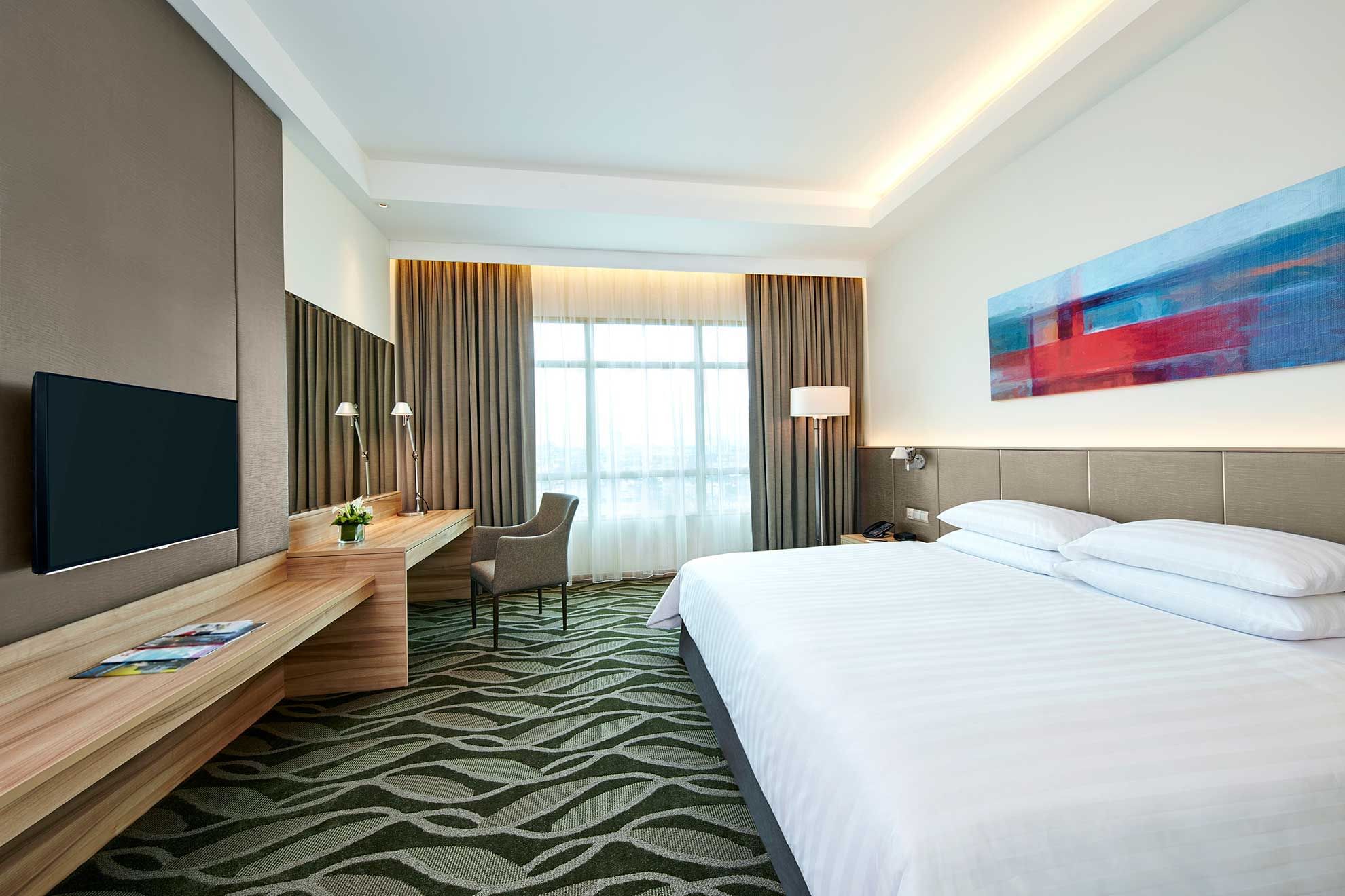 A massive bed in Deluxe Plus Park King Room at Sunway Lagoon