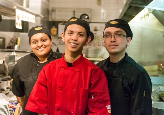 three line-cooks at dennys smiling