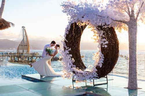 Couple enjoying their wedding day  at Playa Los Arcos
