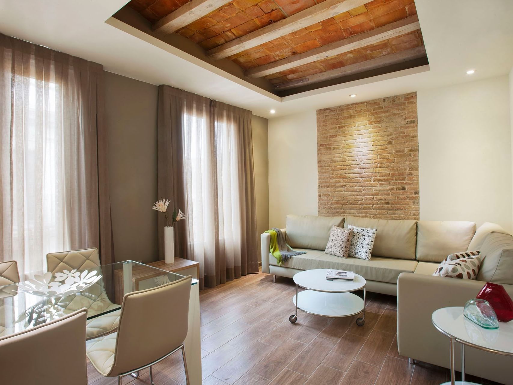 Dining & living area in Deluxe room at Barcelona Apartment