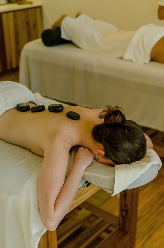 Hot stones on a woman, Spa at Ibagari Boutique Hotel