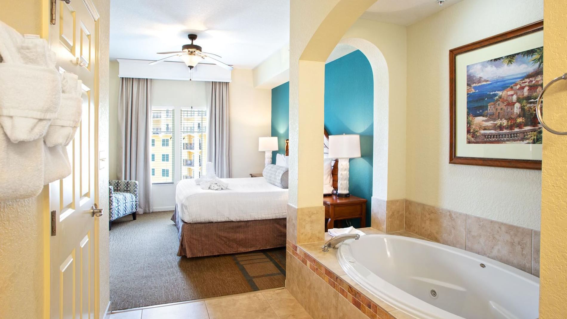 Large bathtub featuring wall art in 4 Bedroom 4 Bath Standard Suite at Lake Buena Vista Resort Village & Spa