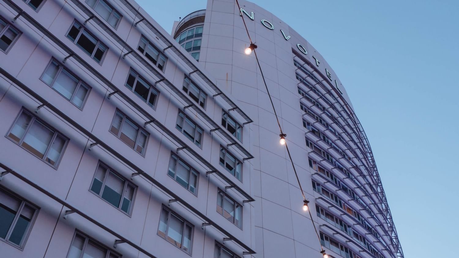 Low-angle view of the hotel at Novotel Sydney Olympic Park