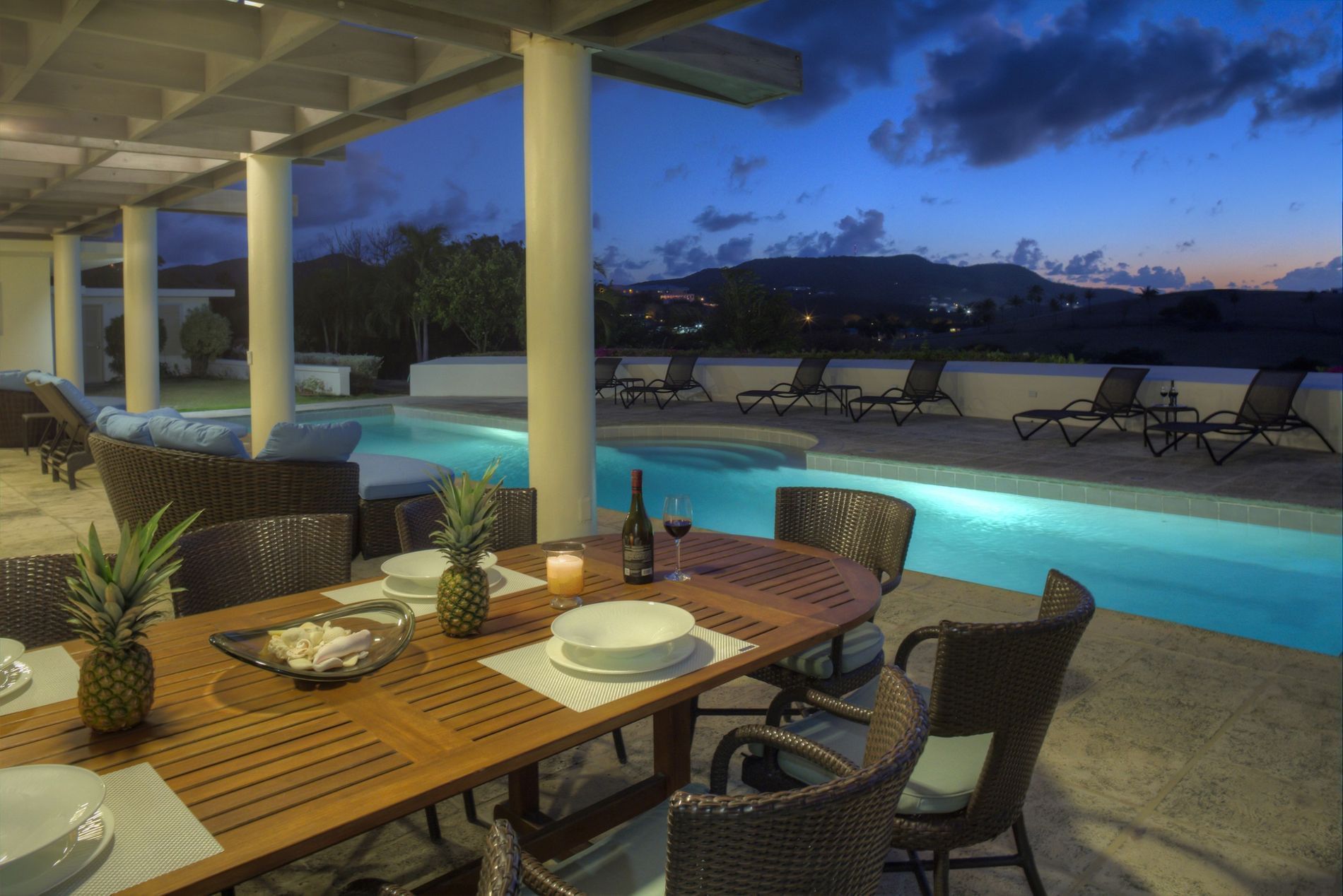 Dining table by the pool area in Beach House at The Buccaneer Resort St. Croix
