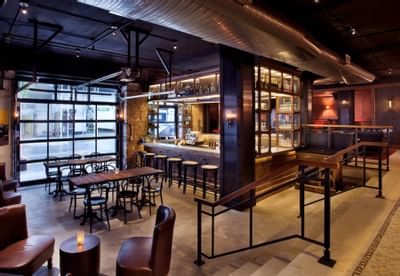 chairs and tables at an outdoor lobby bar