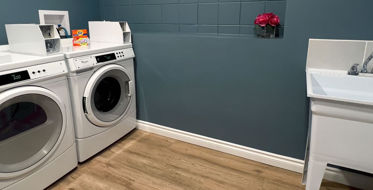 Laundry room with washing machine and sink