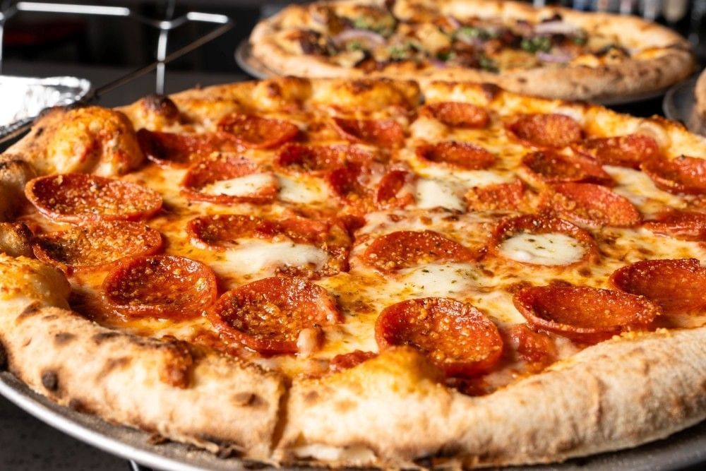 A close-up of a freshly baked pepperoni pizza.
