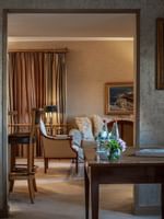 Working desk near the doorway to living area in Royal Suite at Warwick Grand Place Brussels
