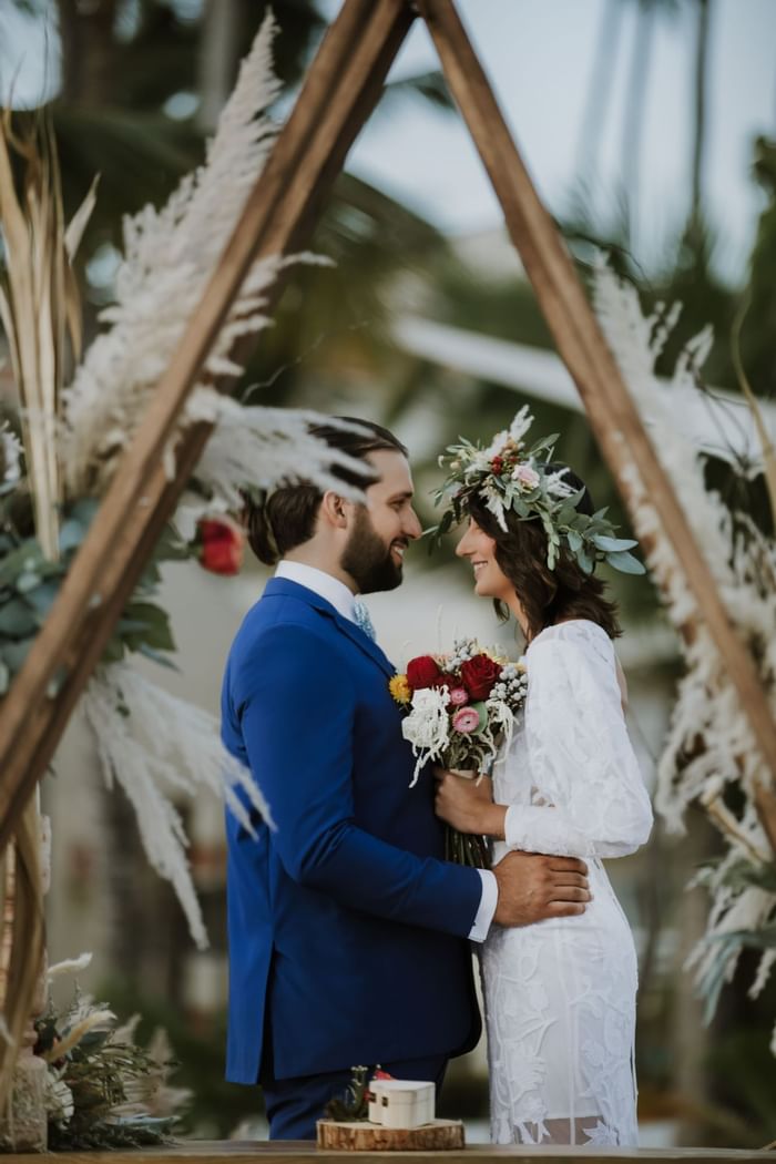 A wedding couple looking at their faces at Club Hemingway