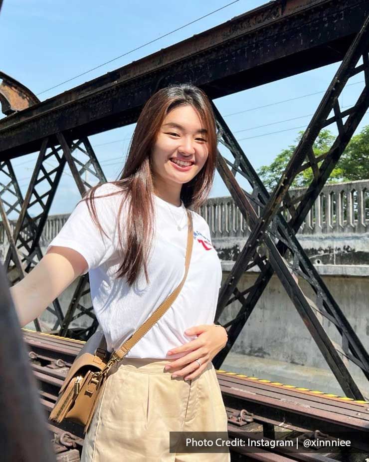 A lady smiled in front of the camera on the Ipoh Victoria Bridge - Lexis Suites Penang 