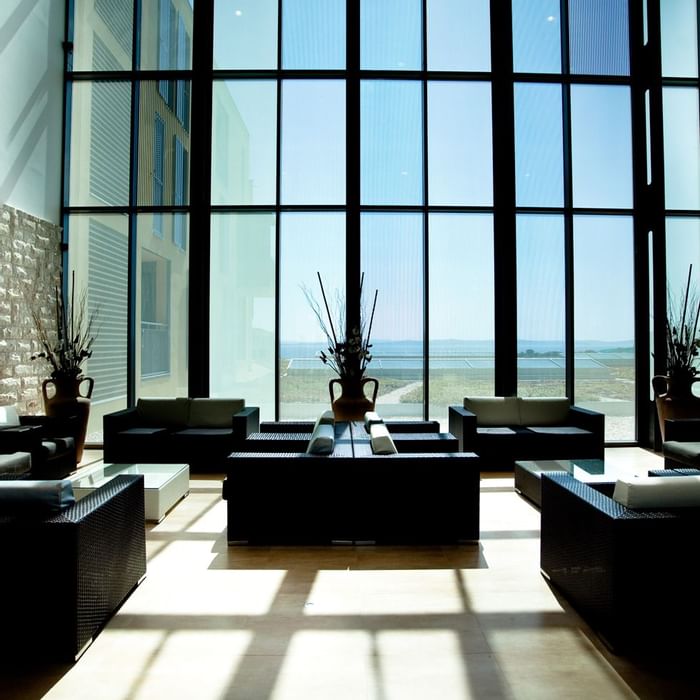 Lobby area with window view at Falkensteiner Hotel Diadora