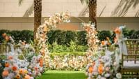 Outdoor wedding chair set-up with flower decorations in The Courtyard at Ocean Park Hotel Hong Kong