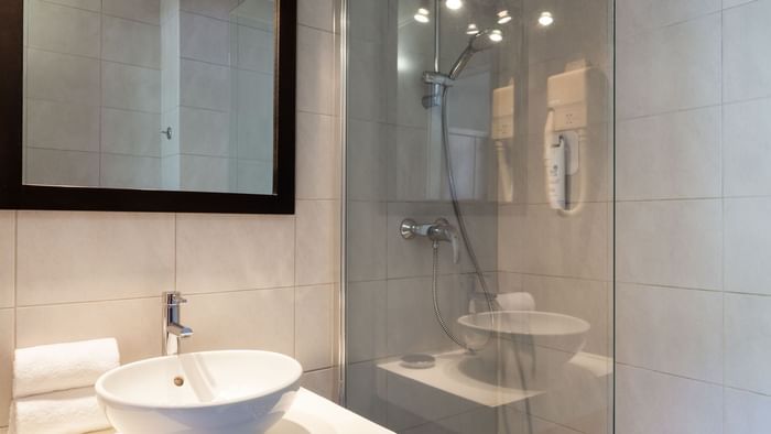 Bathroom vanity in bedrooms at Hotel de l'Ange