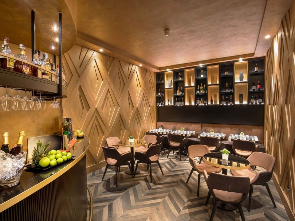 Interior of Lounge Bar with a warm ambience and dining tables at The Style