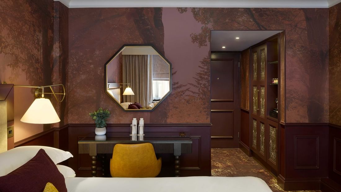 Executive King / Twin room with decorative wallpaper, desk, and gold accents at The Capital Hotel, Apartments & Townhouse.