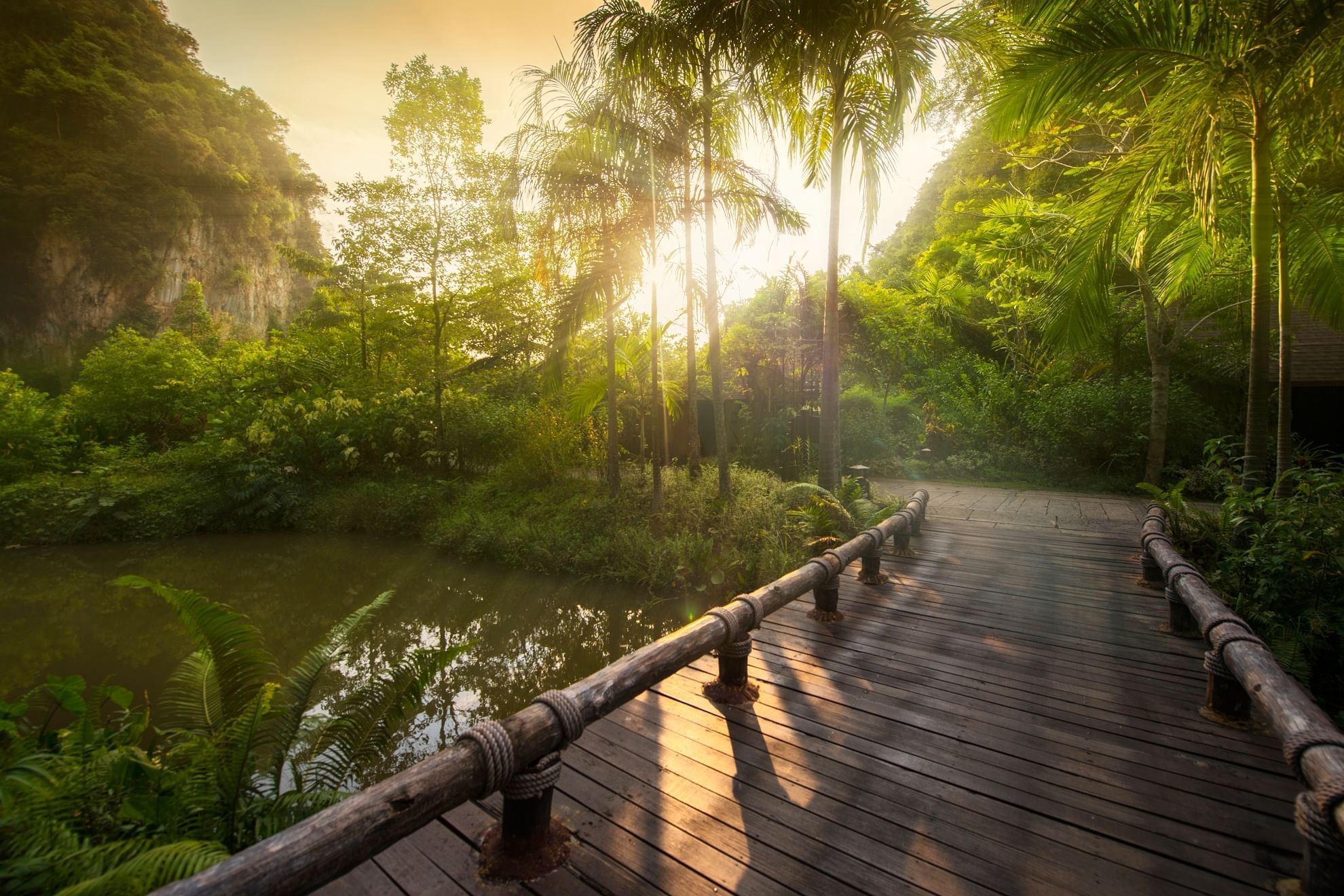 Landscape view of The Banjaran Hotsprings Retreat & a wooden bridge