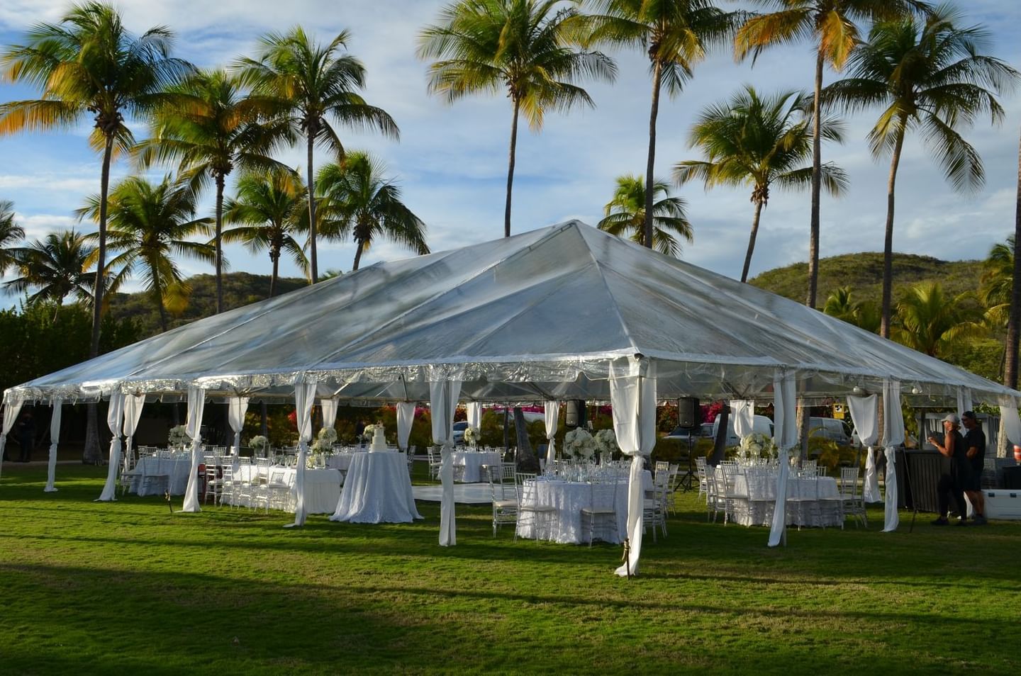 Wedding tent with dining tables at Copamarina Weddings