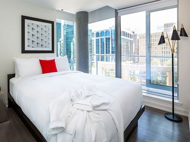 Two bedroom suite - bedroom and balcony view at ReStays Ottawa