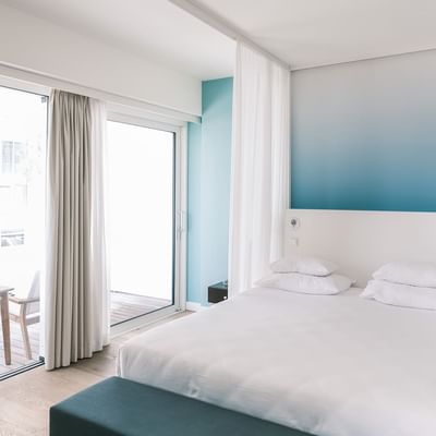 Large bed in Burano Suite sea view at Falkensteiner Hotels
