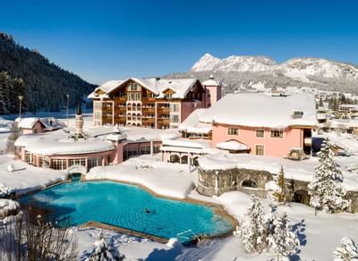 Aerial view of snow-covered Liebes Rot Flueh with the pool area