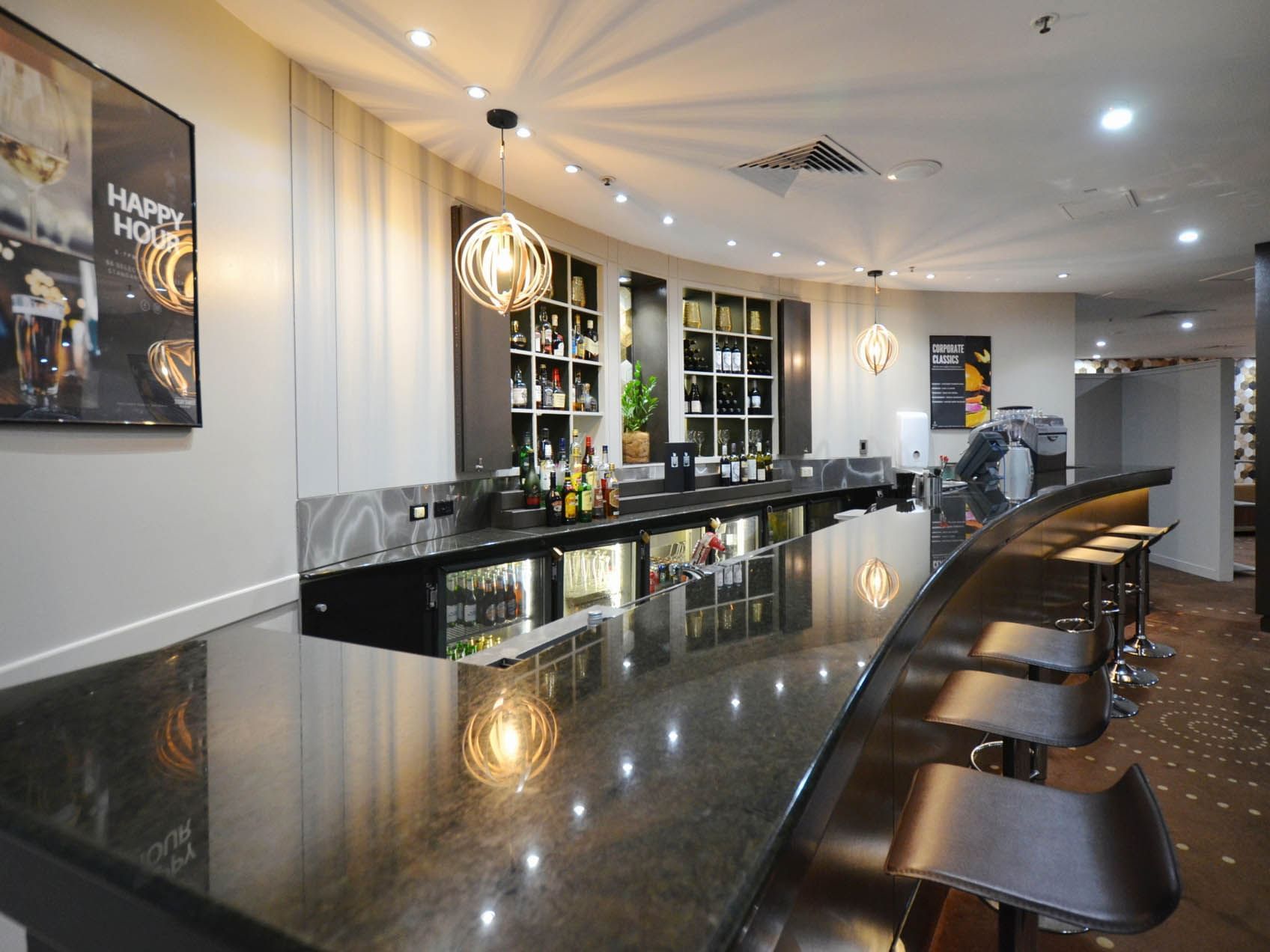 Sugar Shaker Bar with shelves, counter-top & stools at Hotel Grand Chancellor Townsville