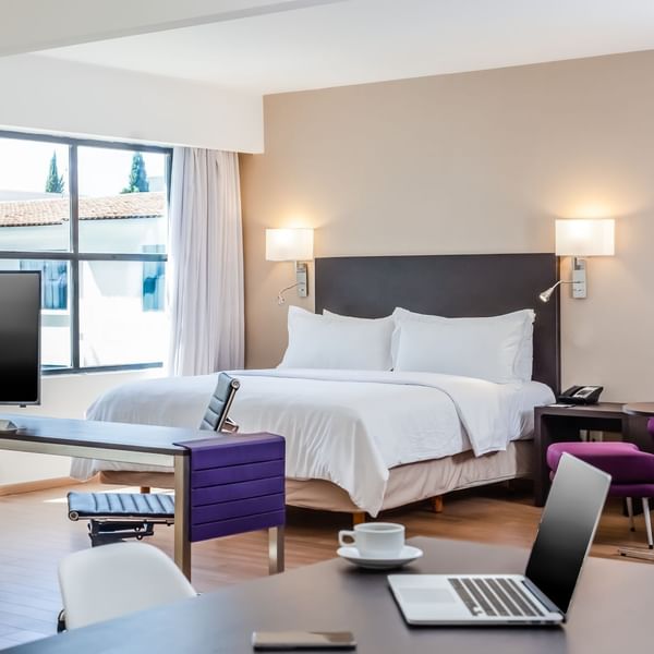 Interior of Junior Suite with working desk at Fiesta Inn
