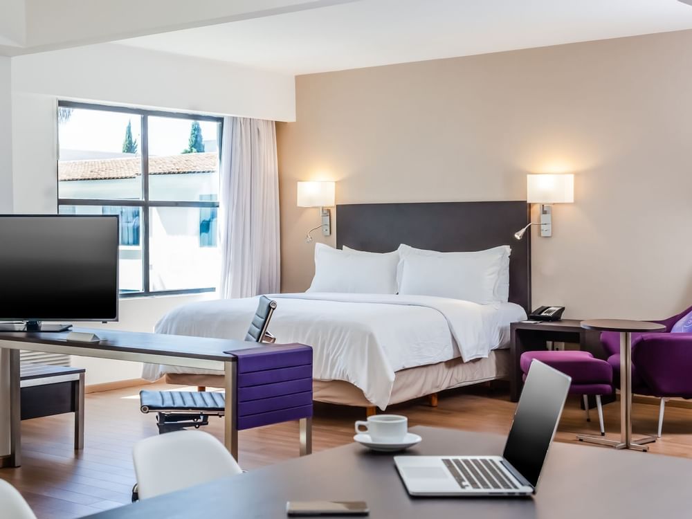 Interior of Junior Suite with working desk at Fiesta Inn