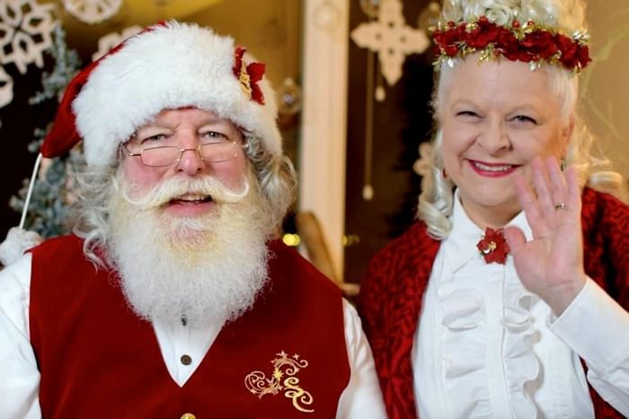 A couple dressed up as Mr. Claus and Mrs. Claus