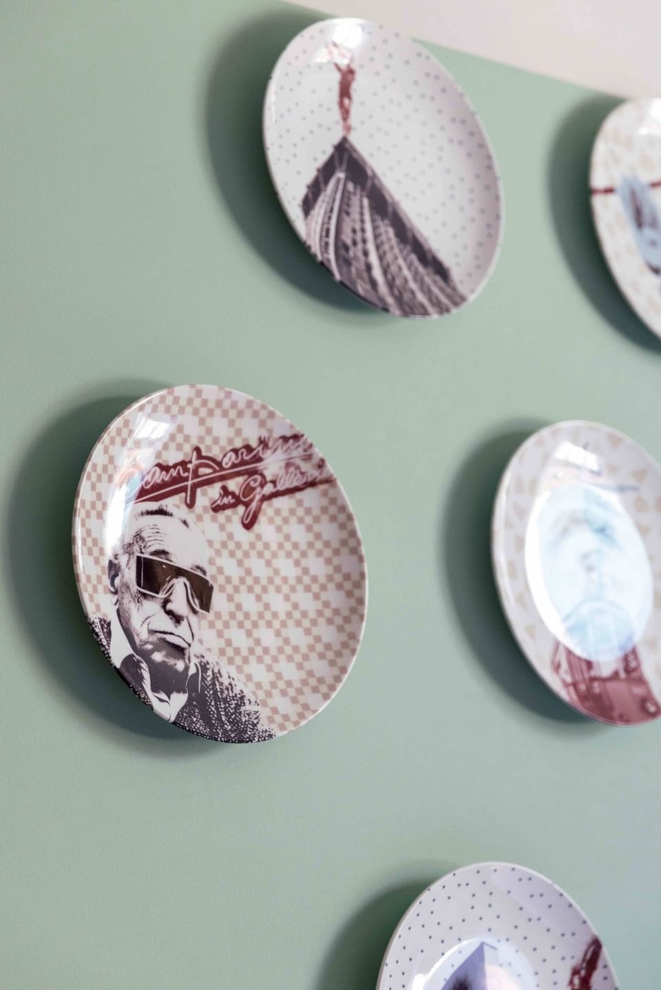 Close-up of round ceramic wall decor at Urban Hive Milano