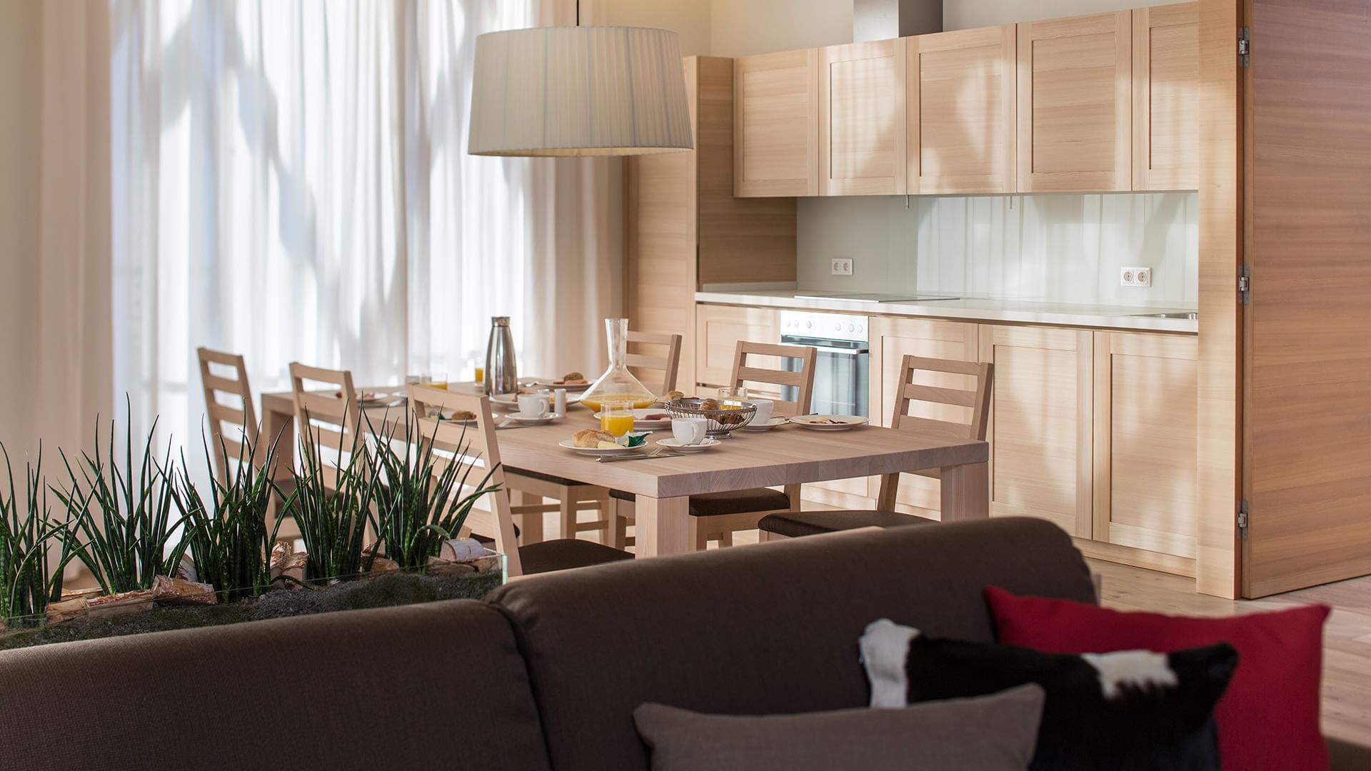 Dining table in Residence Deluxe at Falkensteiner Hotels