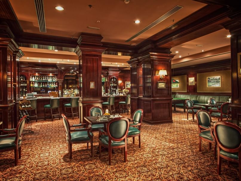 Irish Pub with wood paneling, plush seating & well-stocked bar with set tables at Pickalbatros Golf Beach Resort
