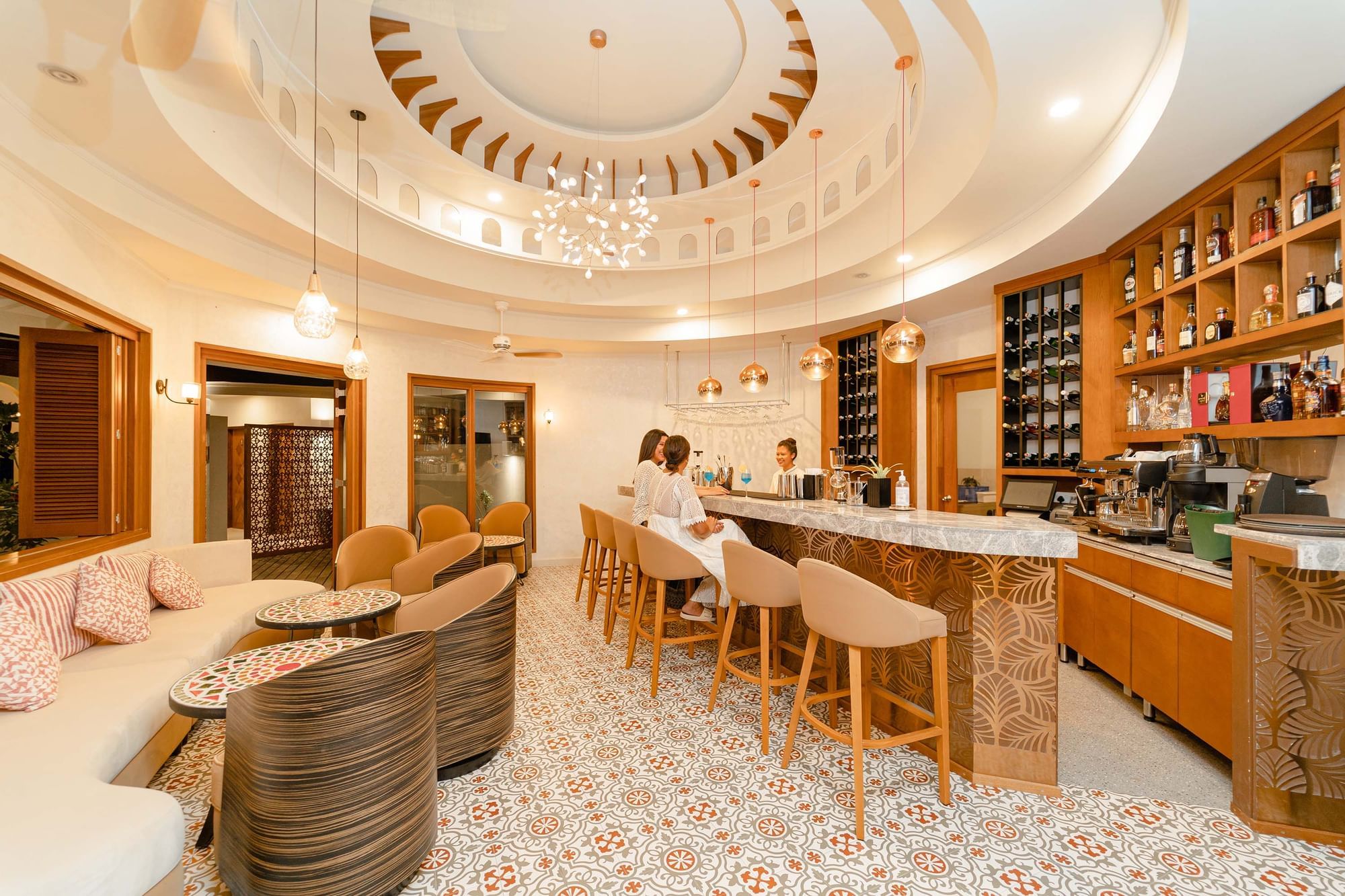 People at the bar counter at The Signature Collection