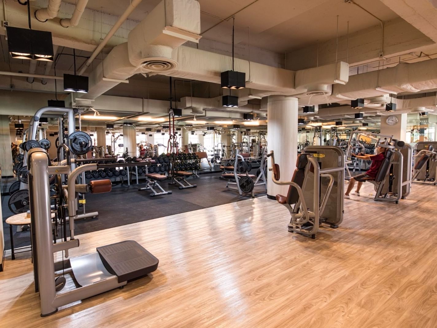 A well-equipped fitness center with polished wooden floors at Eastin Thana City Golf Resort Bangkok