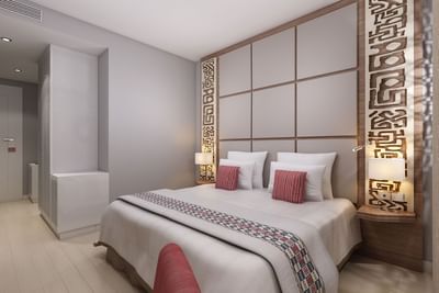 Murals by the king bed in a room at Azalai Hotel Dakar