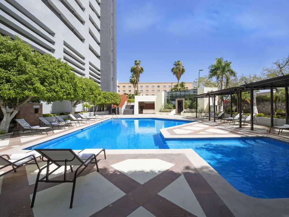 Outdoor Swimming pool area at FA Hotels & Resorts