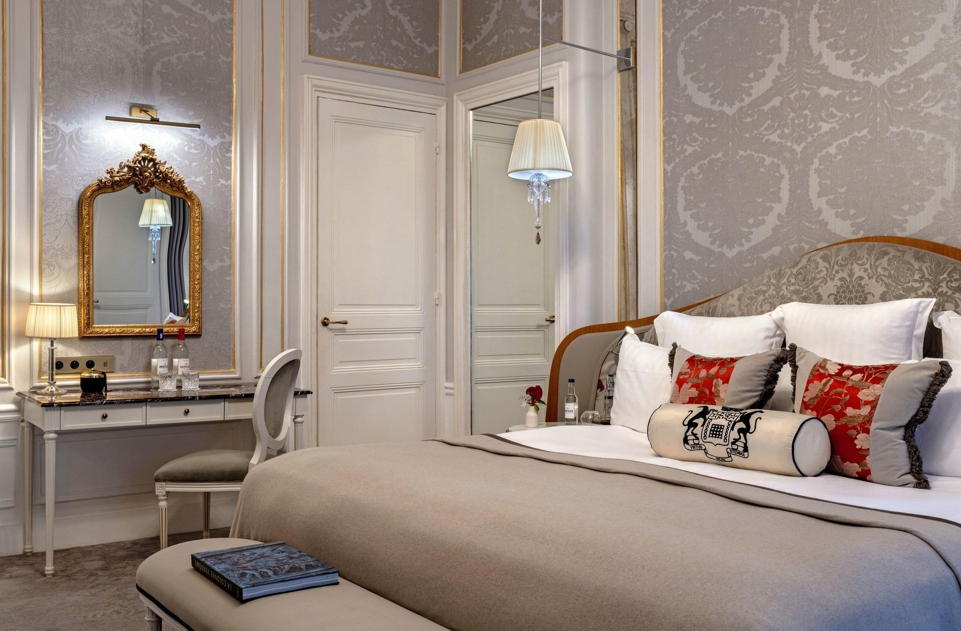 Bed with ottoman near vanity desk in Duke of Westminster Suite bedroom at Hotel Westminster Paris