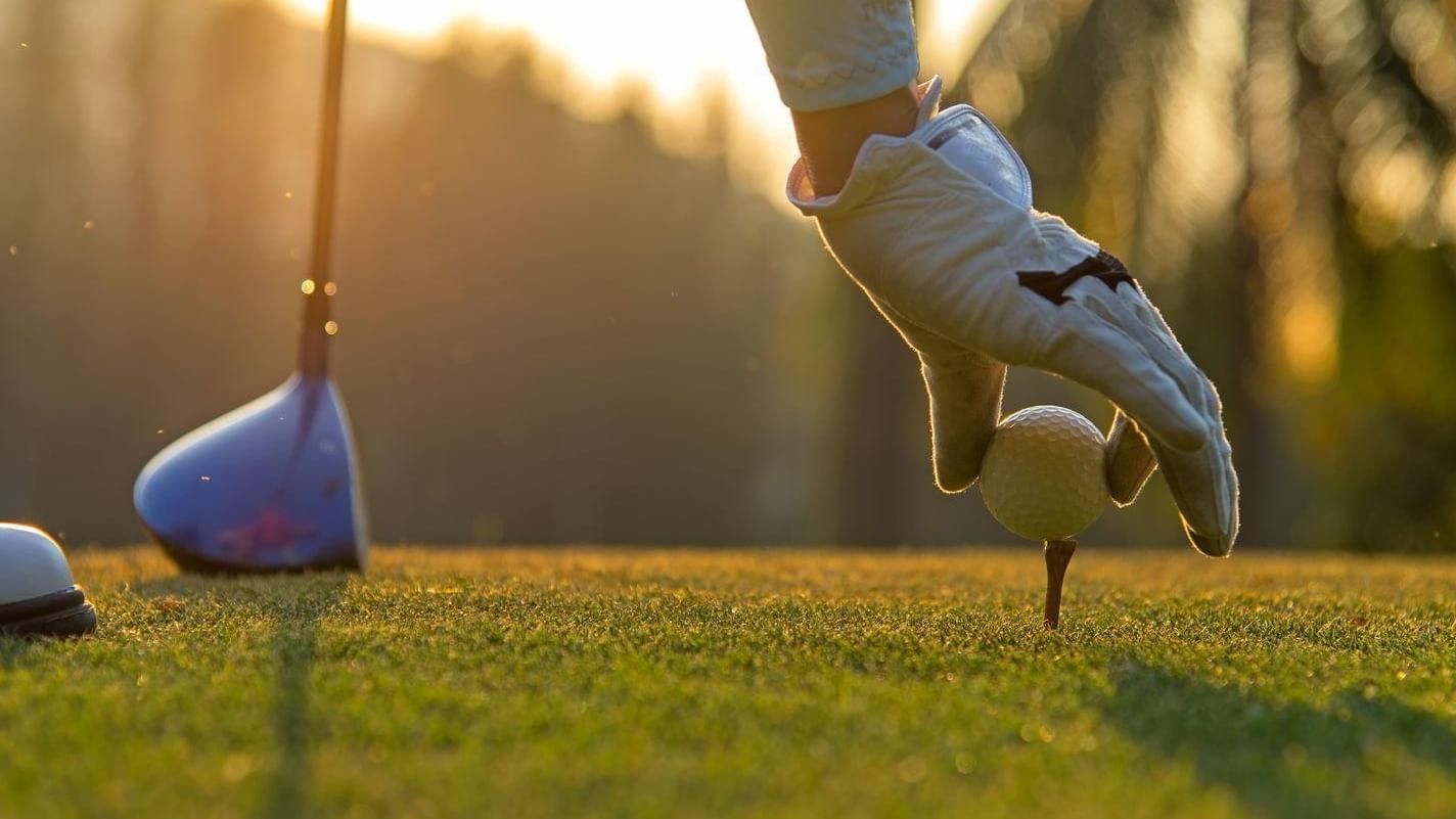 Man set the ball in a golf course at FA Los Cabos All Inclusive