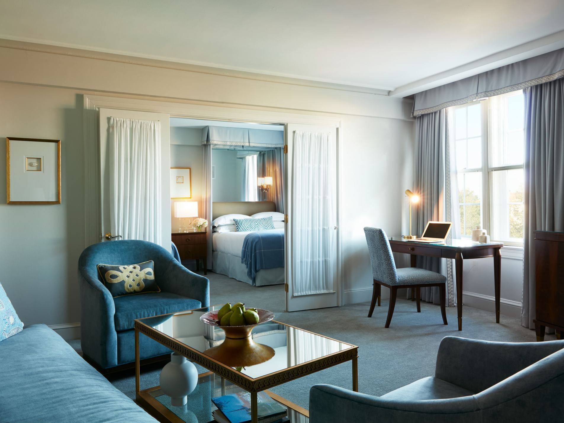 Comfy chairs & work desk in the living area of Two Bedroom Suite, hotel suites Boston in The Eliot Hotel