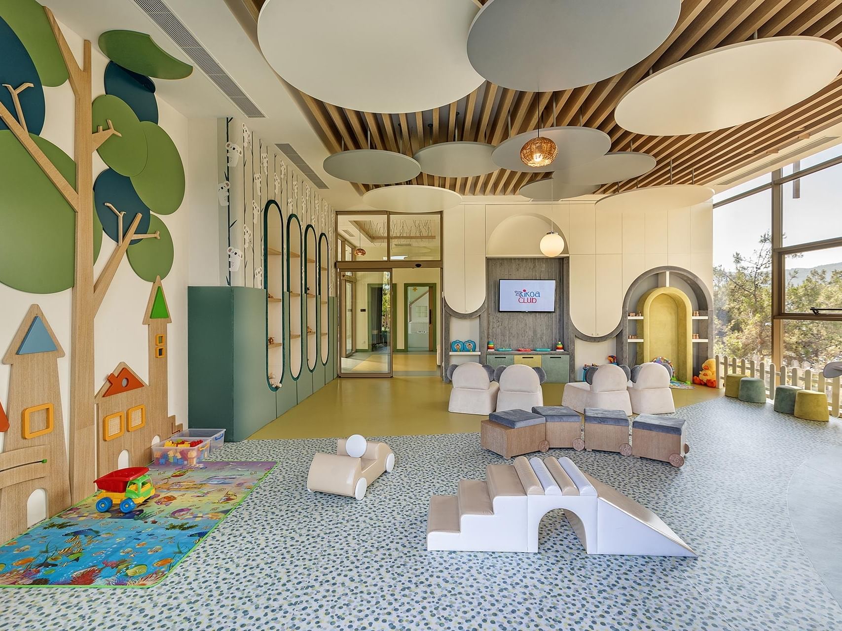 A stylish children's area at Titanic Luxury Collection Bodrum, designed with colorful walls and playful zones.