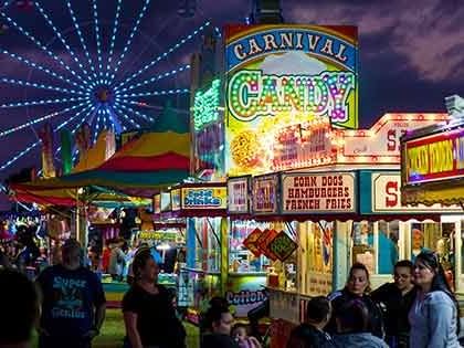 Crowd with Osceola County Fair at night near Lake Buena Vista Resort Village & Spa