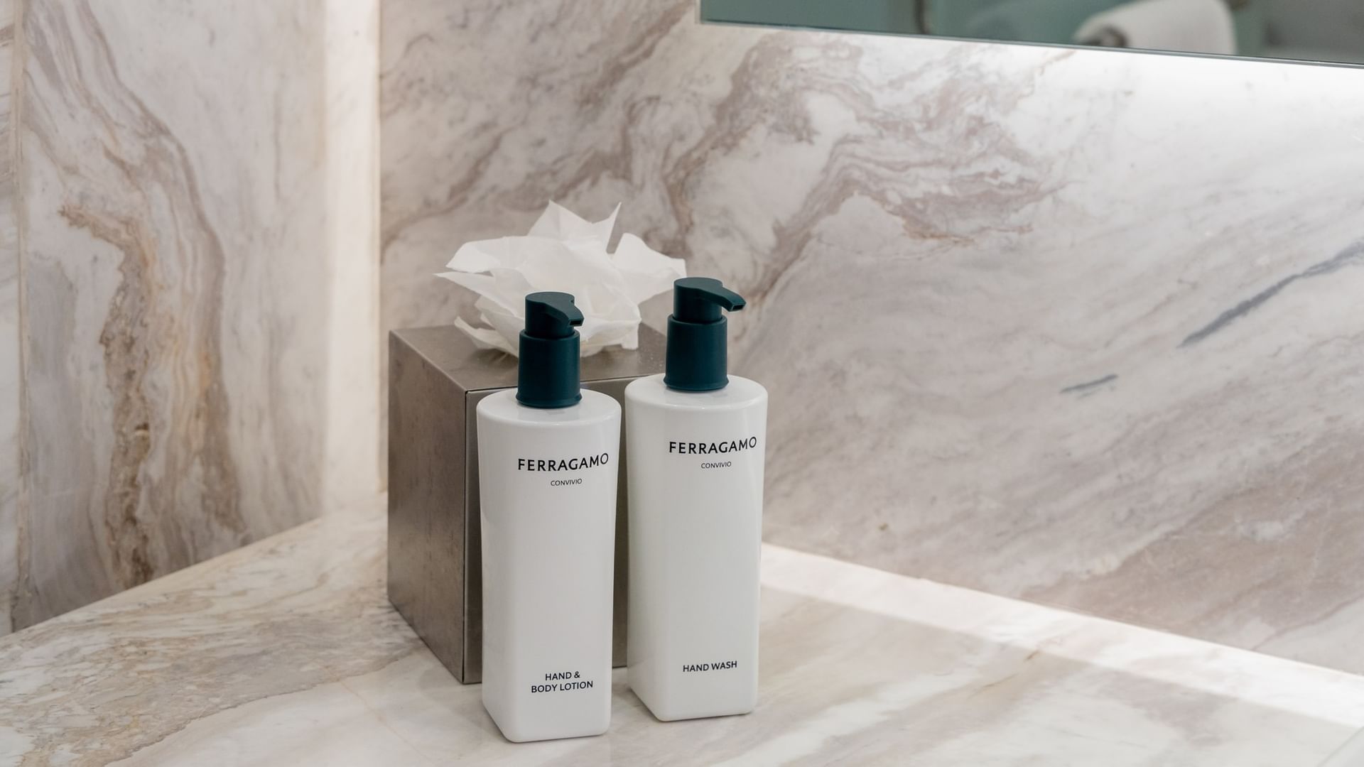 Luxury bathroom amenities with Ferragamo hand and body lotion on marble countertop at Quinta Real Monterrey